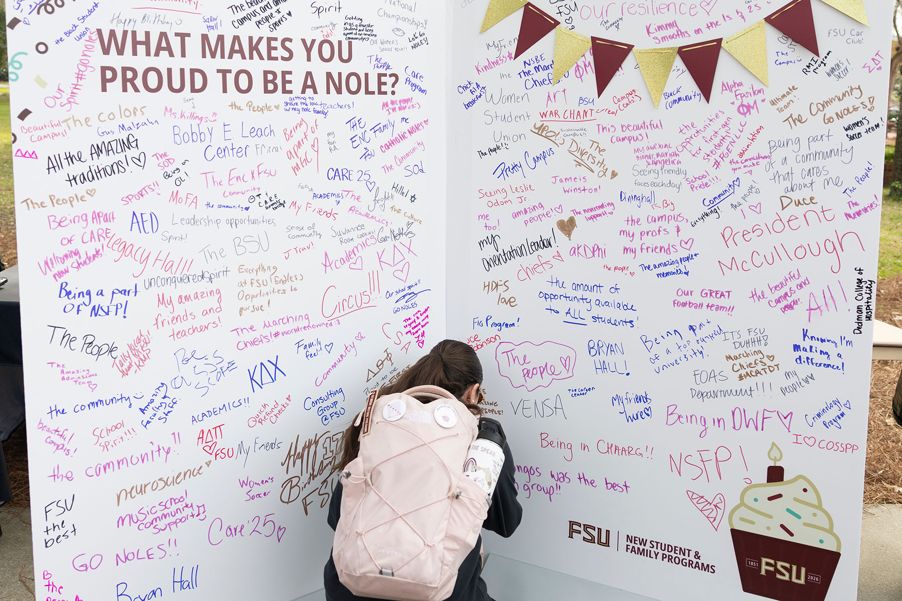 Many students participated by signing a wall labeled “What makes you proud to be a Nole?” on Legacy Walk Wednesday, Jan. 21, 2026. (Matthew McConnell/Florida State University)