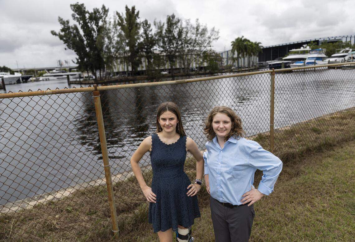 Students Eleonora Mariani, 13, left, and Nate Buck, 12, at the space where a potential new living shoreline may be built near New River Middle School.