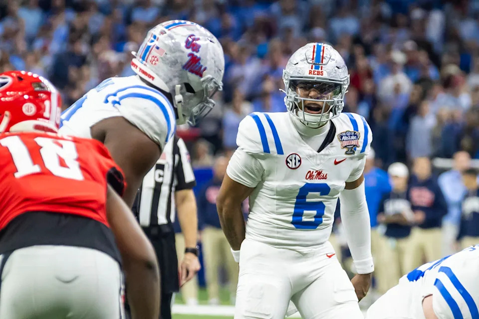 NEW ORLEANS, LA - JANUARY 01: QB Trinidad Chambliss #6 of the Ole Miss Rebels interacts with a teammate during the College Football Playoff Quarterfinal game between the Ole Miss Rebels and the Georgia Bulldogs on Thursday January 1, 2026 at the Caesars Superdome in New Orleans, LA.  (Photo by Nick Tre. Smith/Icon Sportswire via Getty Images)