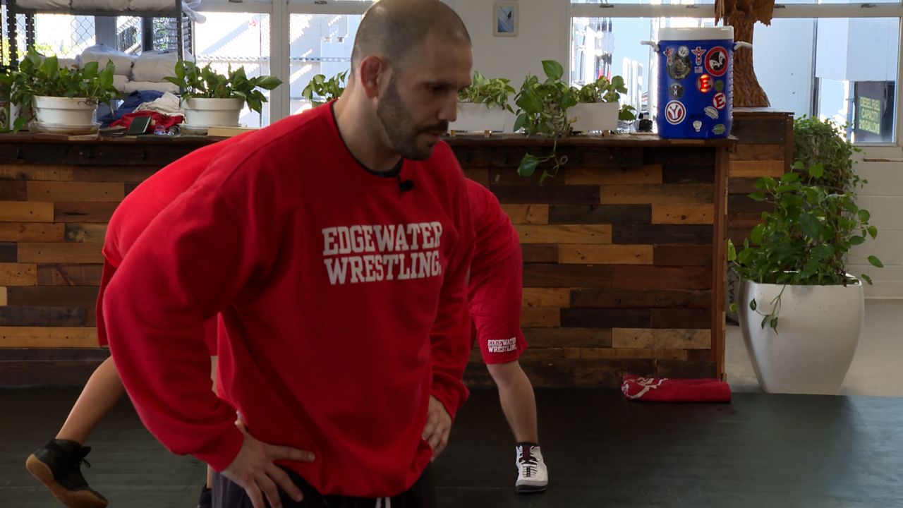 Orlando school resource officer coaches Edgewater wrestling