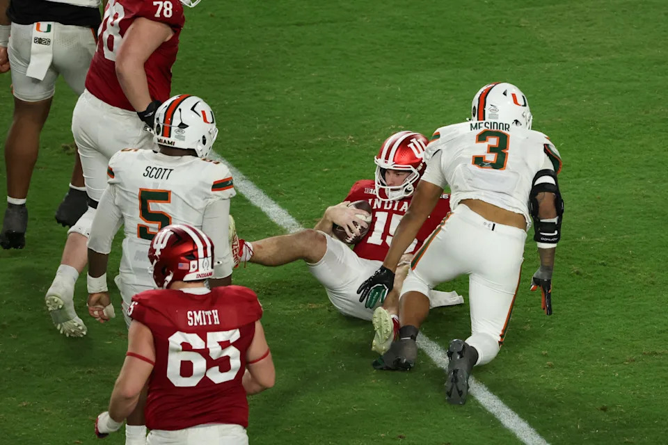 Jan 19, 2026; Miami Gardens, FL, USA; Miami Hurricanes defensive lineman Akheem Mesidor (3) sacks Indiana Hoosiers quarterback Fernando Mendoza (15) in the third quarter during the College Football Playoff National Championship game at Hard Rock Stadium. Mandatory Credit: Kim Klement Neitzel-Imagn Images© Kim Klement Neitzel-Imagn Images&period;