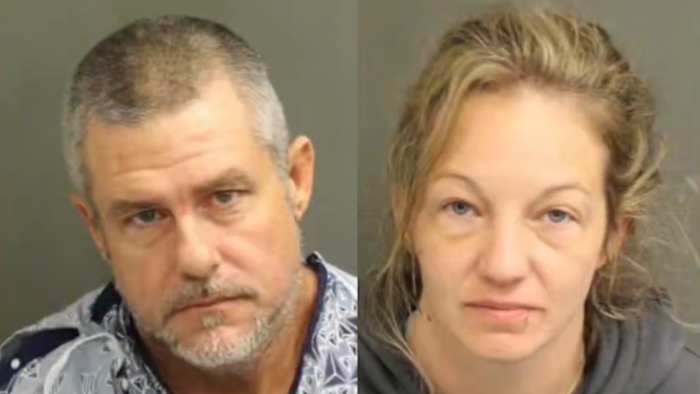 Man, woman caught hiding in bushes after $8,700 chain theft, Orlando police say