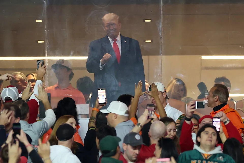 The crowd at the Hard Rock Stadium roared as Trump waved during The Star-Spangled Banner before the Miami Hurricanes and Indiana Hoosiers kicked off the championship game (Getty Images)