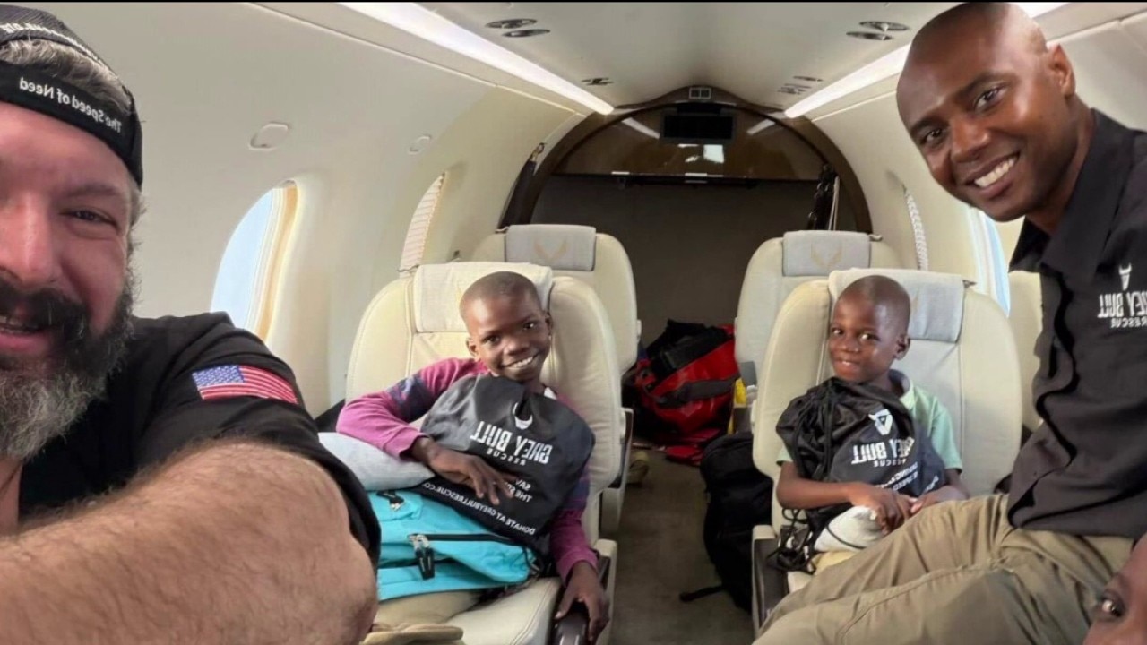 3 Haitian boys unite with adoptive parents