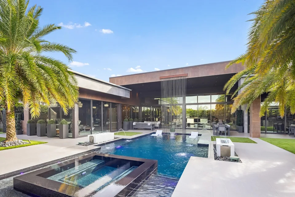 Pool with waterfall in celebrity developer Aldo Stars home in Florida