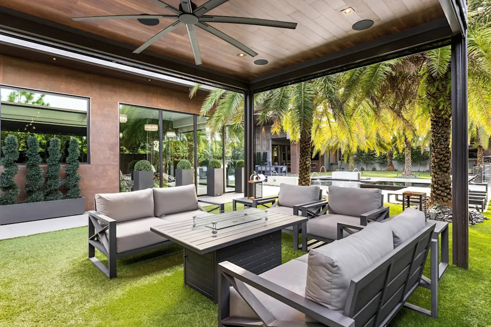 Outdoor seating area in celebrity developer Aldo Stars home in Florida
