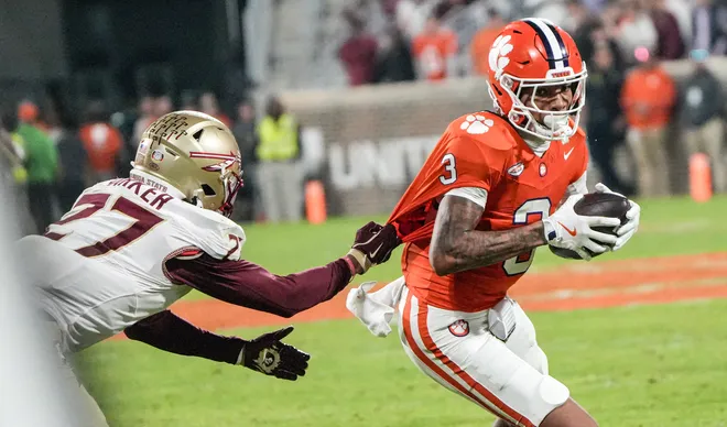 Nov 8, 2025; Clemson, South Carolina, USA; Florida State Seminoles defensive back Ashlynd Barker (27) tackles Clemson Tigers wide receiver Tristan Smith (3) during the second quarter at Memorial Stadium. Mandatory Credit: Ken Ruinard - GREENVILLE NEWS-USA TODAY Network via Imagn Images