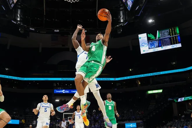 Dec 31, 2025; Memphis, Tennessee, USA; North Texas Mean Green guard Je'Shawn Stevenson (4) shoots the ball against the Memphis Tigers during the second half at FedExForum.