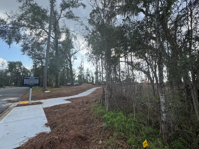 The course property to the Capital City Country Club was once a Whites-only facility and also includes former Houstoun Plantation land containing an unmarked cemetery of Black slaves.