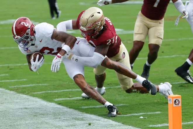 TALLAHASSEE, FLORIDA - AUGUST 30: Ryan Williams #2 of the Alabama Crimson Tide is shoved out of bounds by Ashlynd Barker #27 of the Florida State Seminoles during the first quarter of a football game at Doak Campbell Stadium on August 30, 2025 in Tallahassee, Florida. (Photo by Butch Dill/Getty Images)