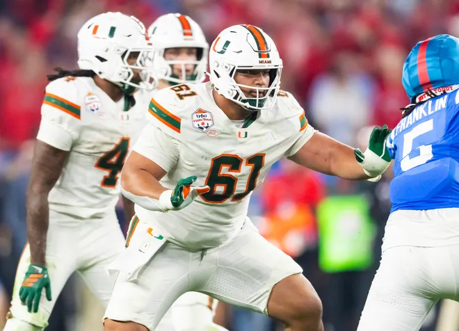 Jan 8, 2026; Glendale, AZ, USA; Miami Hurricanes offensive lineman Francis Mauigoa (61) against the Mississippi Rebels during the 2026 Fiesta Bowl and semifinal game of the College Football Playoff at State Farm Stadium. Mandatory Credit: Mark J. Rebilas-Imagn Images