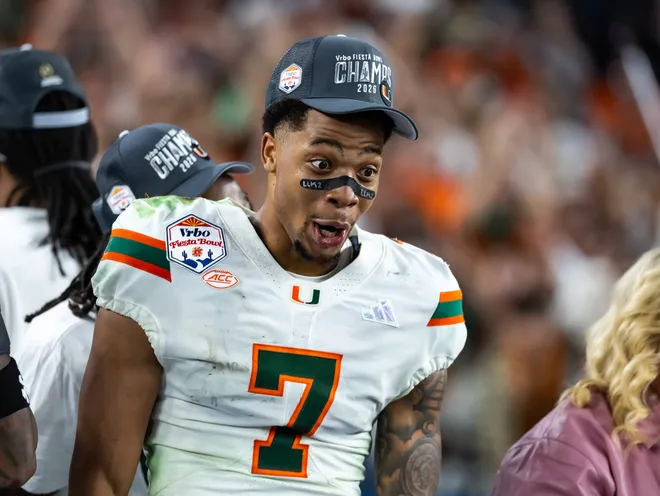 Jan 8, 2026; Glendale, AZ, USA; Miami Hurricanes wide receiver CJ Daniels (7) celebrates after defeating the Mississippi Rebels during the 2026 Fiesta Bowl and semifinal game of the College Football Playoff at State Farm Stadium. Mandatory Credit: Mark J. Rebilas-Imagn Images
