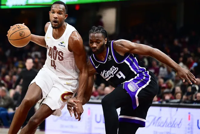Jan 23, 2026; Cleveland, Ohio, USA; Cleveland Cavaliers center Evan Mobley (4) drives to the basket against Sacramento Kings forward Precious Achiuwa (9) during the second half at Rocket Arena.