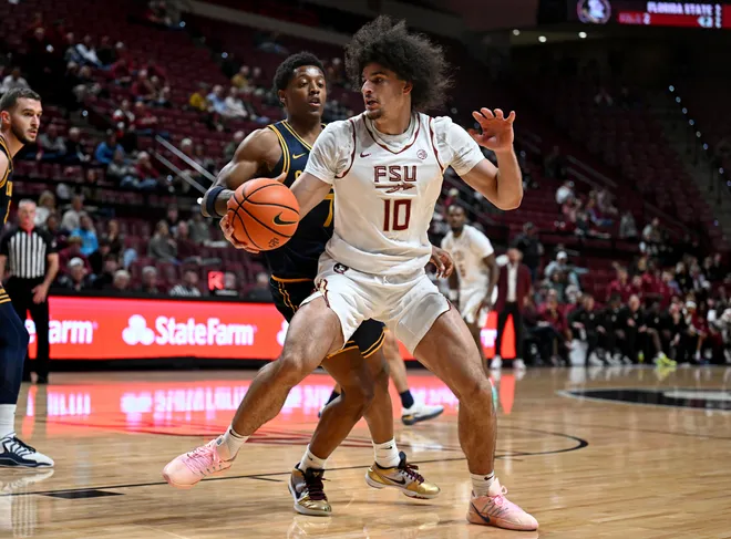 Jan 28, 2026; Tallahassee, Florida, USA; Florida State Seminoles guard Lajae Jones (10) drives to the net as California Golden Bears guard Dai Dai Ames (7) defends during the first half at Donald L. Tucker Center. Mandatory Credit: Melina Myers-Imagn Images