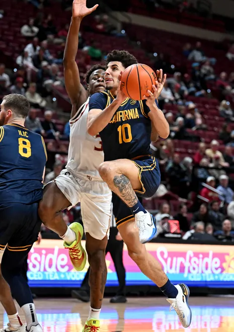 Jan 28, 2026; Tallahassee, Florida, USA; California Golden Bears guard Justin Pippen (10) goes for a layup as Florida State Seminoles forward Thomas Bassong (3) defends during the second half at Donald L. Tucker Center. Mandatory Credit: Melina Myers-Imagn Images