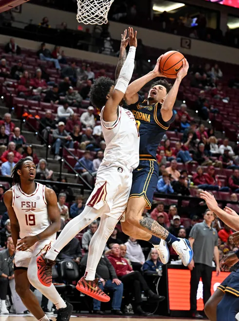 Jan 28, 2026; Tallahassee, Florida, USA; California Golden Bears guard Justin Pippen (10) makes a shot as Florida State Seminoles guard Martin Somerville (1) goes up to block during the second half at Donald L. Tucker Center. Mandatory Credit: Melina Myers-Imagn Images