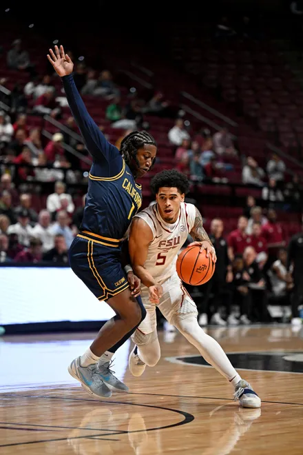 Jan 28, 2026; Tallahassee, Florida, USA; California Golden Bears DeJuan Campbell (1) defends Florida State Seminoles guard Kobe MaGee (5) during the first half at Donald L. Tucker Center. Mandatory Credit: Melina Myers-Imagn Images