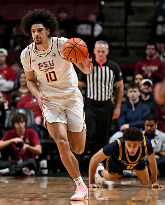 Jan 28, 2026; Tallahassee, Florida, USA; Florida State Seminoles guard Lajae Jones (10) drives the ball up the court after a steal on California Golden Bears guard Justin Pippen (10) during the first half at Donald L. Tucker Center. Mandatory Credit: Melina Myers-Imagn Images