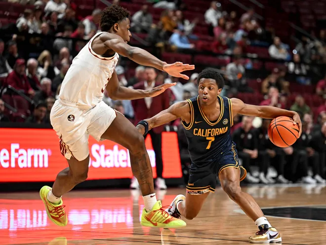 Jan 28, 2026; Tallahassee, Florida, USA; California Golden Bears Dai Dai Ames (7) drives to the net past Florida State Seminoles forward Thomas Bassong (3) during the second half at Donald L. Tucker Center. Mandatory Credit: Melina Myers-Imagn Images