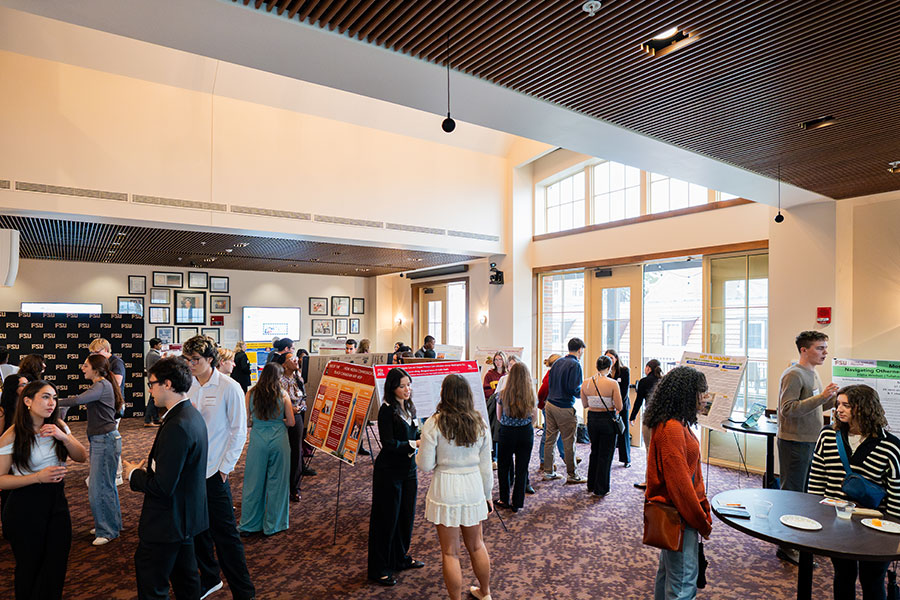 Overview shot of the 2025 Global Scholars Showcase in the Nancy H. Marcus Great Hall at the Honors, Scholars, and Fellows House.