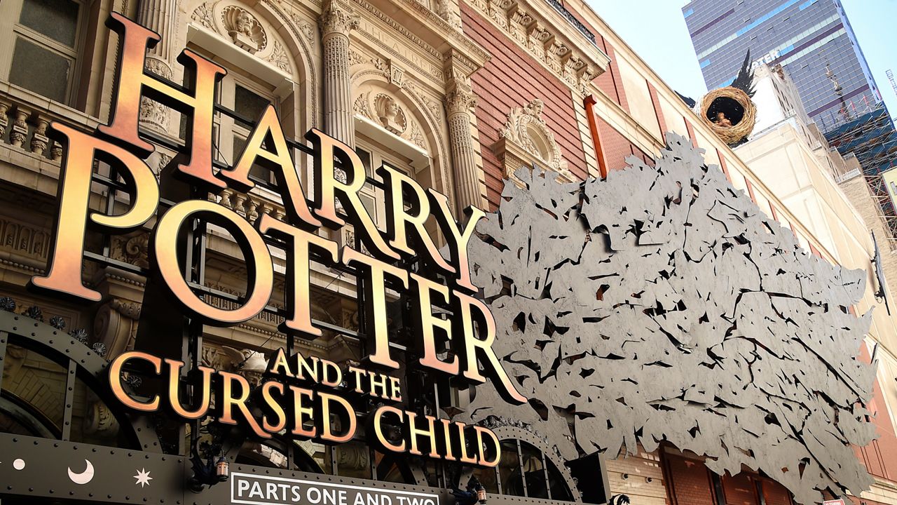 FILE - A sign for "Harry Potter and the Cursed Child" hangs at the Broadway opening at the Lyric Theatre on Sunday, April 22, 2018, in New York. (Photo by Evan Agostini/Invision/AP, File)
