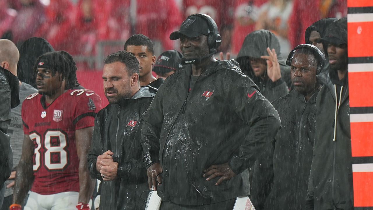 Tampa Bay Buccaneers head coach Todd Bowles watches the action in the rain during an NFL football game against the Carolina Panthers, Sunday, Jan 3, 2026, in Tampa, Fla. (AP Photo/Peter Joneleit)