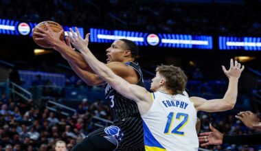 Orlando Magic guard Desmond Bane (3) goes to the basket defended by Indiana Pacers guard Johnny Furphy (12) during the first half of an NBA basketball game, Sunday, Jan. 4, 2026, in Orlando, Fla. (AP Photo/Kevin Kolczynski)