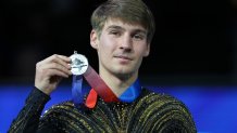 Silver medalist Andrew Torgashev poses with his medal during the men's free skate competition at the U.S. Figure Skating Championships, Saturday, Jan. 10, 2026, in St. Louis. (AP Photo/Stephanie Scarbrough)