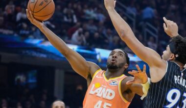 Cleveland Cavaliers guard Donovan Mitchell (45) goes to the basket past Orlando Magic forward Noah Penda (93) in the first half of an NBA basketball game in Cleveland, Monday, Jan. 26, 2026. (AP Photo/Sue Ogrocki)
