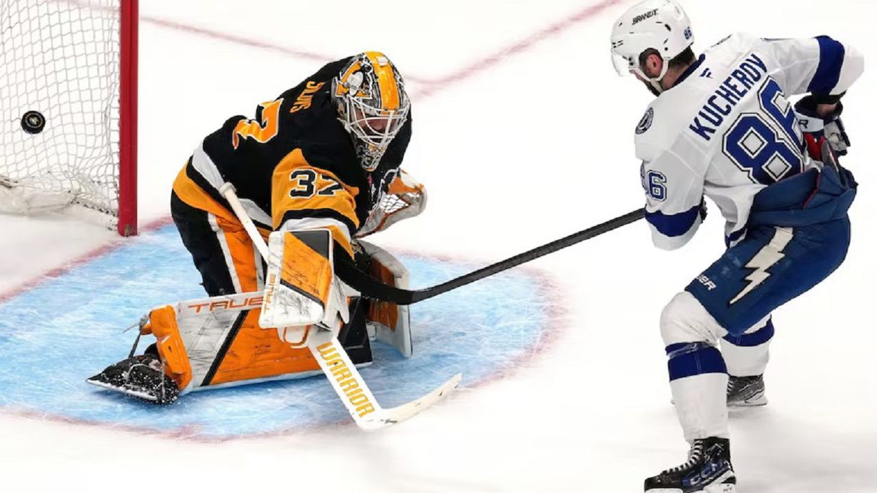 Tampa Bay's Nikita Kucherov (86) scores past Penguins goaltender Arturs Silovs (37) in the third round of the shootout to lift Tampa Bay to a 2-1 victory Tuesday night in Pittsburgh. (AP Photo/Gene J. Puskar)