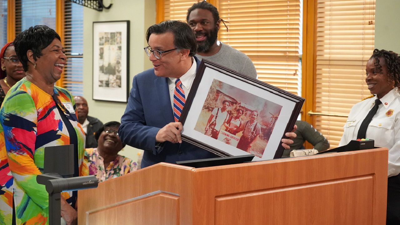 During Thursday’s city council meeting, Councilman Luis Viera presented Betty Coleman with a plaque as she was surrounded by her family, current Fire Chief Barbara Tripp, city leaders and residents. (Tampa Fire Rescue)