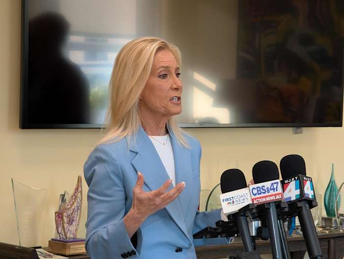 Deegan says employee was placed on leave for policy violation, not for discussing reported increased ICE presence