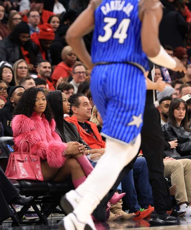 Chicago Sky player Angel Reese watches from the court side as Magic center Wendell Carter Jr. moves up-court in the first quarter against the Bulls at the United Center on Jan. 2, 2026, in Chicago. (John J. Kim/Chicago Tribune)