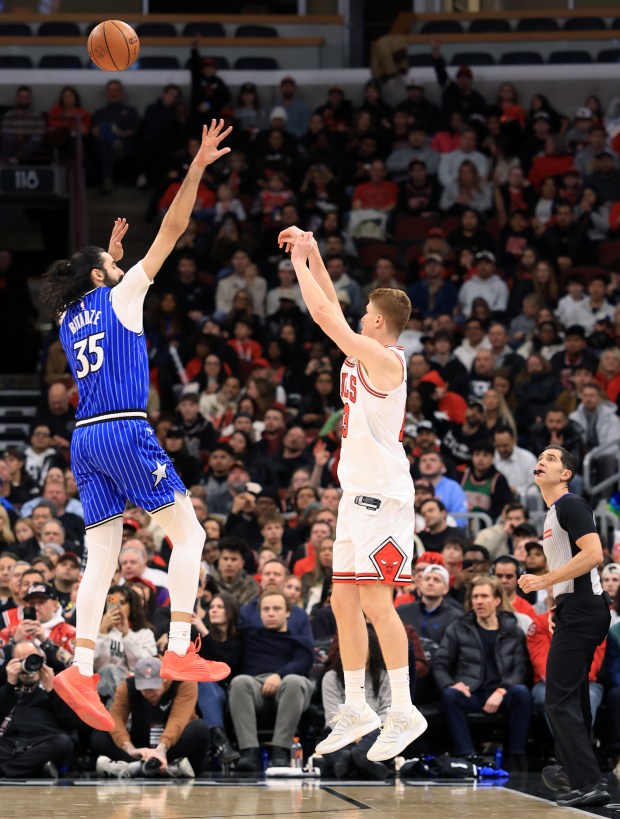 Bulls guard Kevin Huerter releases a successful 3-pointer as Magic center Goga Bitadze (35) defends in the third quarter at the United Center on Jan. 2, 2026, in Chicago. (John J. Kim/Chicago Tribune)