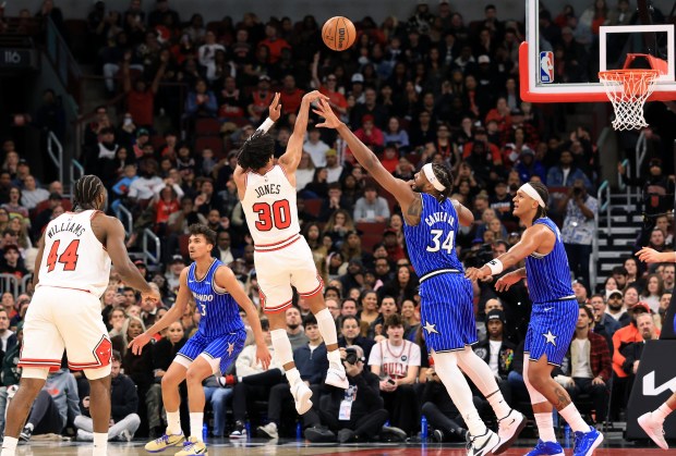 Bulls guard Tre Jones releases the ball for two points as the shot clock runs out in the fourth quarter against the Magic at the United Center on Jan. 2, 2026, in Chicago. (John J. Kim/Chicago Tribune)