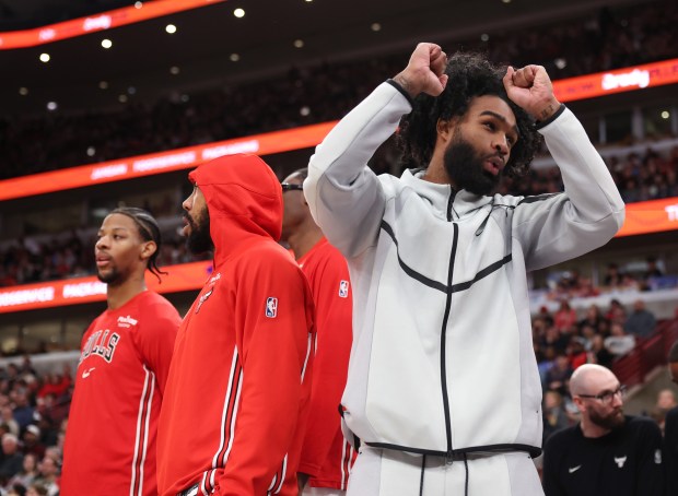 Bulls guard Coby White, right, watches in street clothes in the fourth quarter against the Magic at the United Center on Jan. 2, 2026, in Chicago. (John J. Kim/Chicago Tribune)