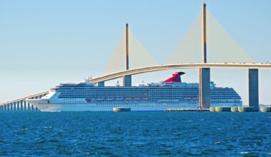 Carnival ship sailing under Tampa Sunshine Skyway Bridge
