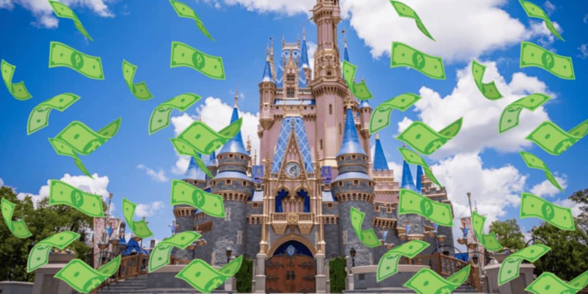 A fantasy castle, resembling Disney’s Cinderella Castle, stands under a blue sky as cartoon-style money bills rain down—hinting at Disney World increasing prices on thousands of food items in the parks.