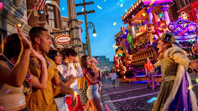 Clients can book coveted bead-throwing spots on a Universal Mardi Gras parade float.