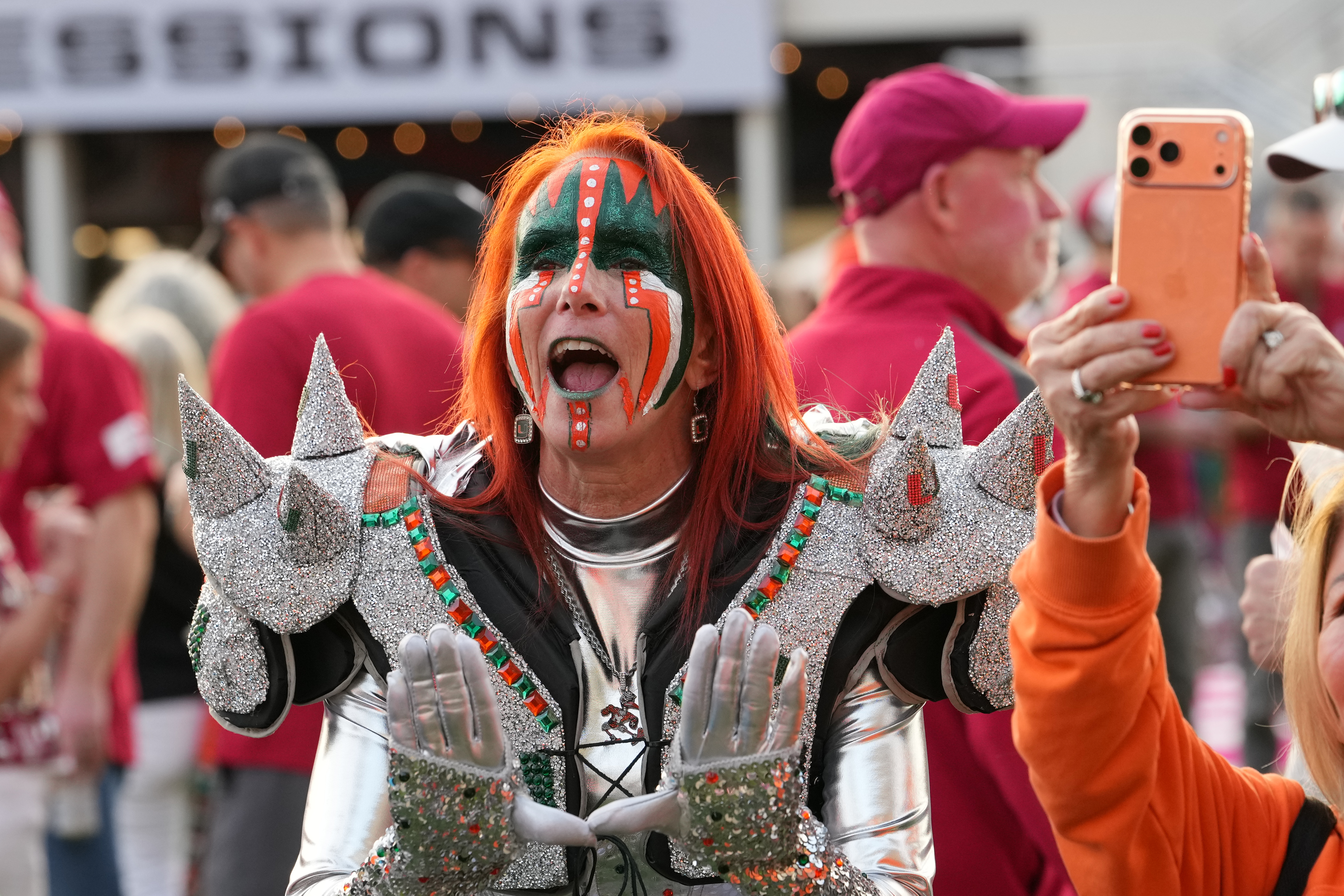 Fans arrive for the College Football Playoff national championship game between Miami and Indiana, Monday, Jan. 19, 2026, in Miami Gardens, Fla. (AP Photo/Lynne Sladky)