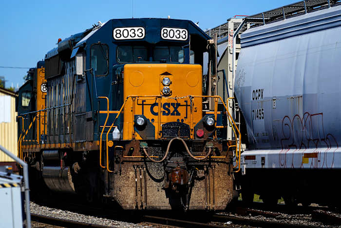 CSX railroad profit slips 2% as shipping demand remained weak and severance costs hurt results