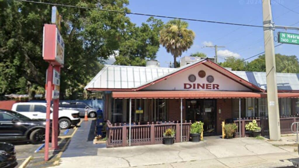 exterior of a diner with a pink facade