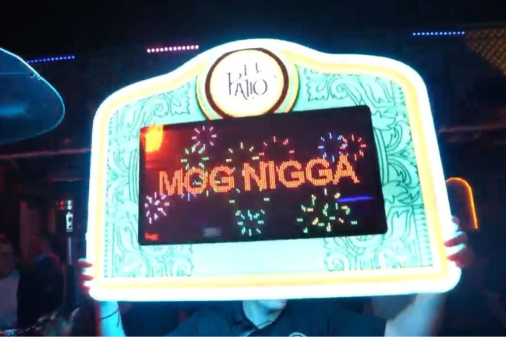 photo of a bottle service sign that reads Mog Nigga