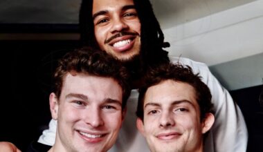photo of three football players posing together
