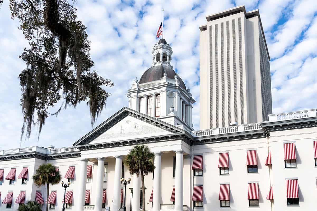 Photograph of the old Florida State Capitol in Tallahassee taken from the front of the building. The New Capitol building stands behind it. (Photo: ©JHVE Photo)