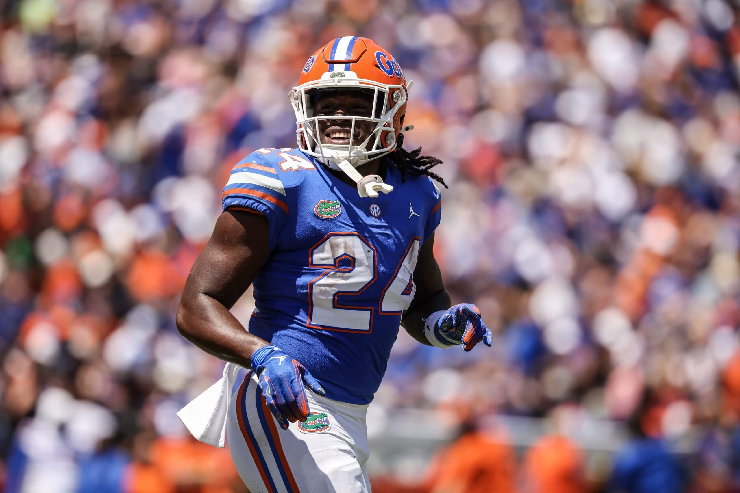 Ja'kobi Jackson smiles and runs off the field