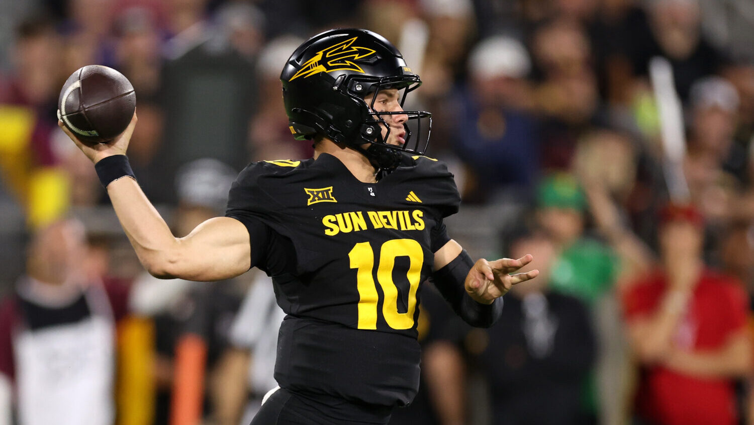 Quarterback Sam Leavitt #10 of the Arizona State Sun Devils passes the ball against the TCU Horned ...