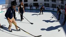 MIAMI, FLORIDA - JANUARY 9:  Students put on hockey gear and try out their rink during the Legacy Project for the 2026 Discover Winter Classic is a partnership between the NHL, the Florida Panthers, and the SLAM! School Miami. This is to establish a permanent home for the synthetic auxiliary rink used during the Winter Classic game at SLAM! Miami School Gym Space on January 9, 2026 in Miami, Florida. (Photo by Eliot J. Schechter/NHLI via Getty Images)