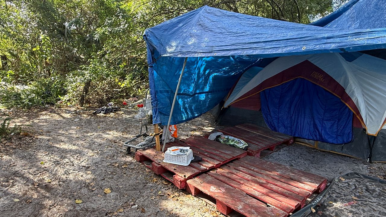 A homeless person is living in this tent in a homeless camp in east Orange County. (Spectrum News