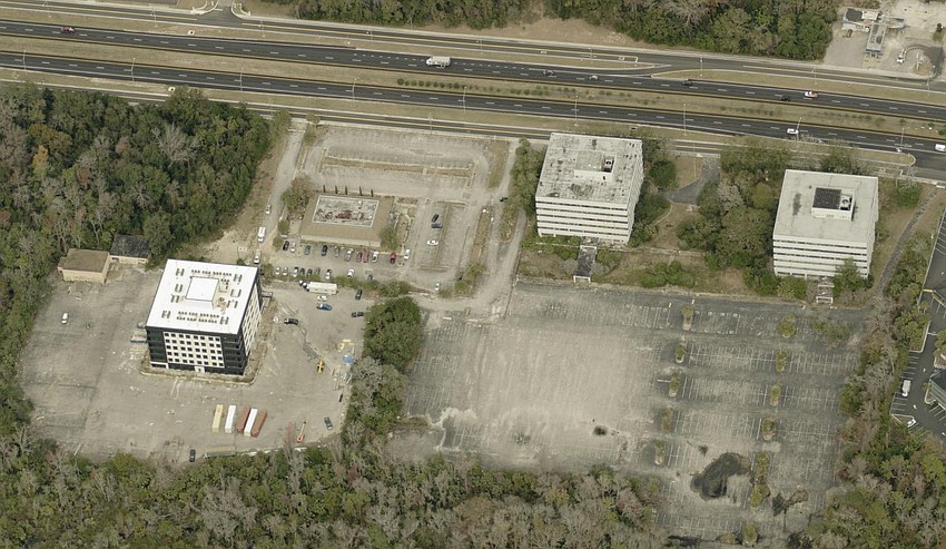 An aerial view of renovated Interra Apartment Homes, left, at 8000 Arlington Expressway. The two vacant Offshore Power Systems office buildings, at right, are also planned for renovation into apartments. An aerial view of renovated Interra Apartment Homes, left, at 8000 Arlington Expressway. The two vacant Offshore Power Systems office buildings, at right, are also planned for renovation into apartments.